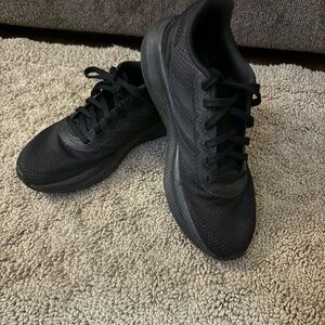 Women’s black Adidas sneakers